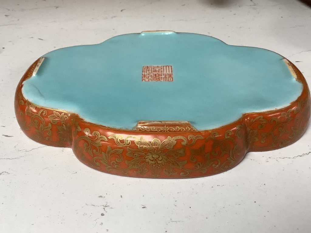 A Chinese coral ground inscribed dish, width 18cm